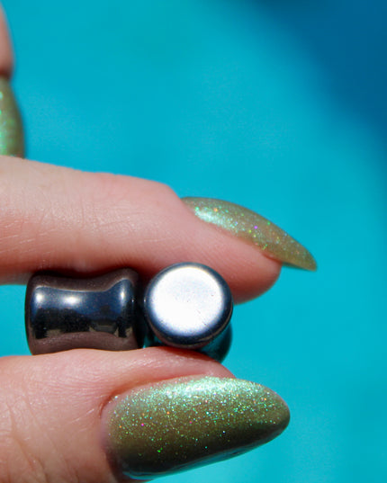 Crafted from polished natural hematite, these plugs offer a sleek, metallic finish with a cool, gunmetal-gray sheen. Smooth and weighty, hematite plugs provide a comfortable fit while giving off a bold, minimalist look. Known for its grounding and balancing properties, hematite is a favorite among those who seek both style and energetic stability. Ideal for stretched ears, these plugs combine natural beauty with a modern edge.